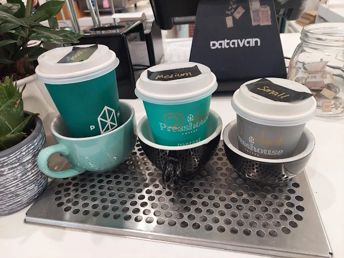 Presshouse takeaway cups in teal, mint and grey