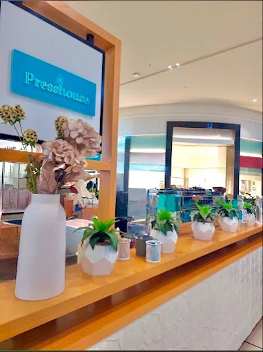 The teal Presshouse Coffee signage